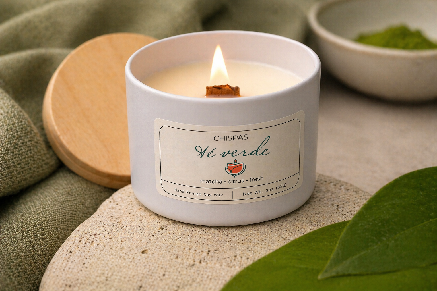 Té Verde candle by Chispas with a lit wooden wick, styled with green leaves and matcha elements in a calm, natural setting.