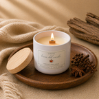 Hand-poured Brisa del Caribe candle by Chispas with a wooden wick burning on a tray, surrounded by warm spiced elements.