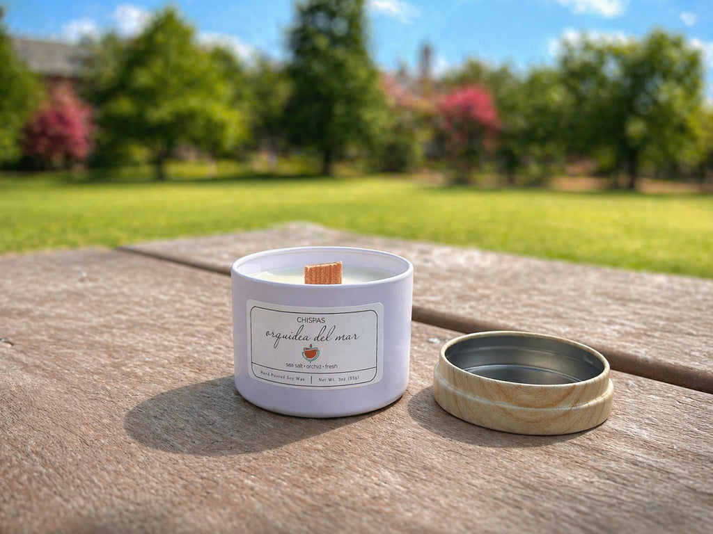 Orquídea del Mar candle outdoors on wooden table, fresh ocean inspired coconut soy candle with wood wick