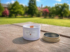 Orquídea del Mar candle outdoors on wooden table, fresh ocean inspired coconut soy candle with wood wick